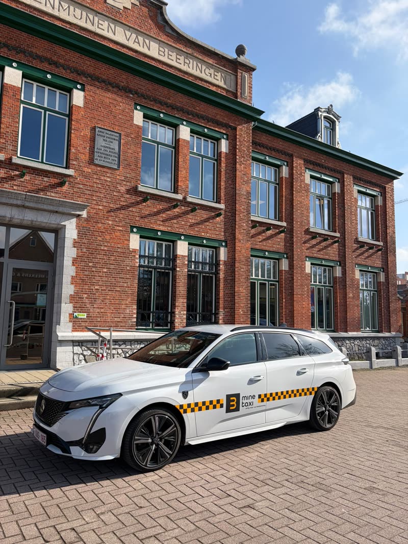 White BMINE taxi estate car in front of the former mine offices in Beringen